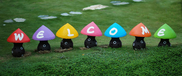 High angle view of multi colored mushroom lamp on field