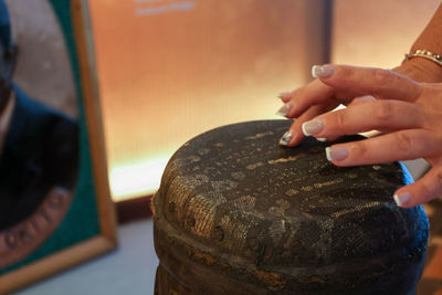 Woman playing african ethnic percussion drum. drummer plays african music on instrument djembe. 