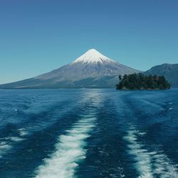 Scenic view of mountains against clear blue sky