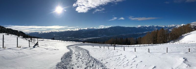 Scenic view of snow covered mountains against sky