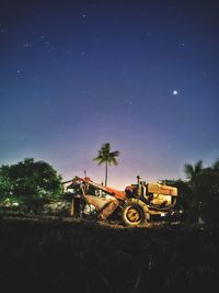 Tractor on field against clear sky