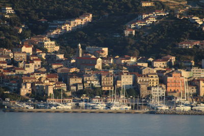 Aerial view of townscape by sea