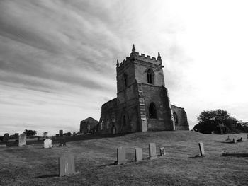 View of cemetery against cloudy sky