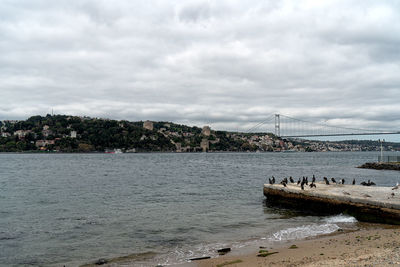 Bridge over sea against sky