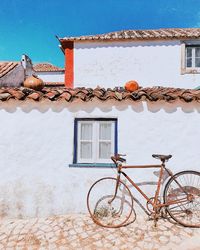 Bicycle against wall of building