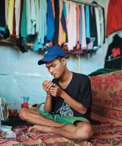 Portrait of man smoking in the shop
