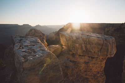 Scenic view of mountains against clear sky during sunset