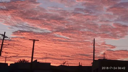 Low angle view of silhouette building against sky during sunset