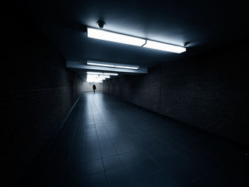 Low angle view of illuminated tunnel