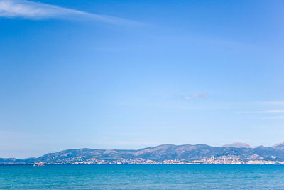 Scenic view of sea against blue sky