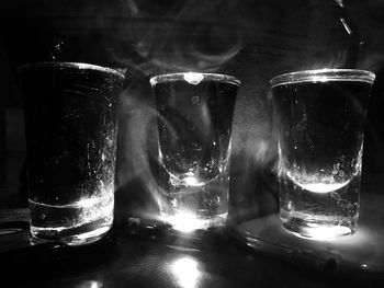 Close-up of wine glasses on table
