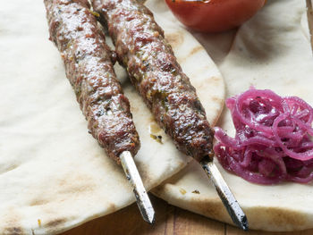 Close-up of fresh shish kebab lamb meat on skewers