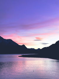 Scenic view of lake against romantic sky at sunset