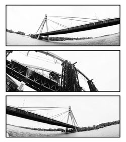 Low angle view of suspension bridge against sky