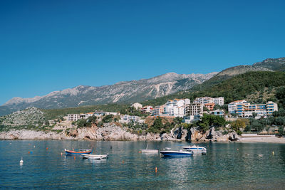 Scenic view of sea against clear blue sky