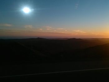 Scenic view of landscape against sky at night