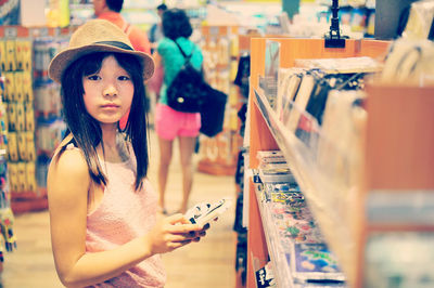 Portrait of woman standing in store