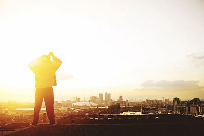 Rear view of woman standing in city