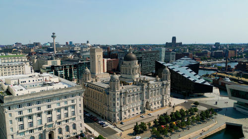 High angle view of buildings in city against clear sky