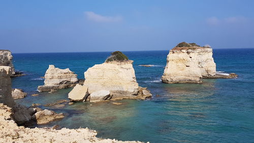 Scenic view of sea against blue sky