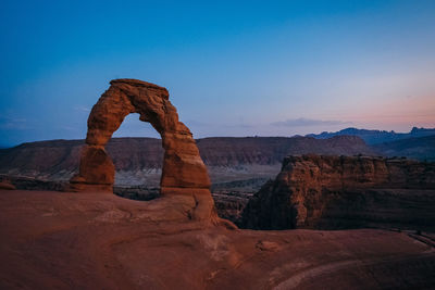 Rock formations on landscape against sky