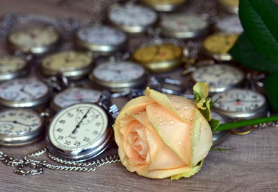 Close-up of pocket watch collection on a table