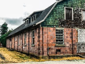 Low angle view of old building against sky