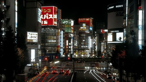 Illuminated city street at night