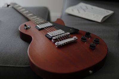 Close-up of guitar on table