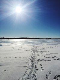 Scenic view of frozen lake against sky