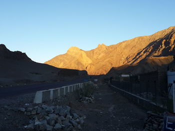 Scenic view of mountains against clear blue sky