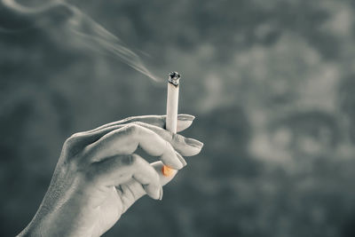Hand holding cigarette