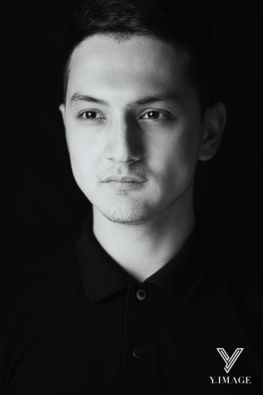 young adult, person, headshot, lifestyles, portrait, looking at camera, front view, young men, studio shot, indoors, black background, serious, leisure activity, close-up, confidence, human face, mid adult, beard