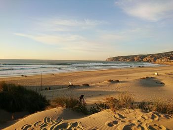 Scenic view of beach against sky