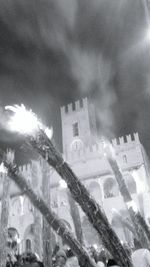 Low angle view of illuminated cathedral against sky at night