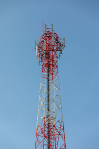 Low angle view of communications tower against sky