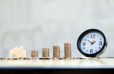 Close-up of clock on table