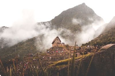 Panoramic shot of historic building against mountain range. machu picchu