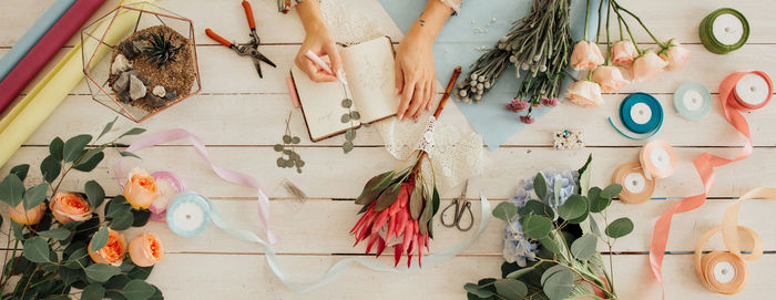 High angle view of various flowers hanging on wall