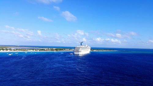 Cruise ship sailing on sea against sky