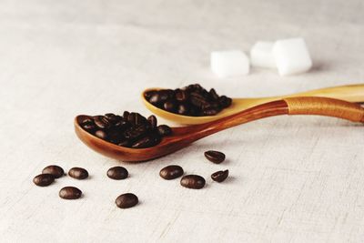 Close-up of coffee beans on table