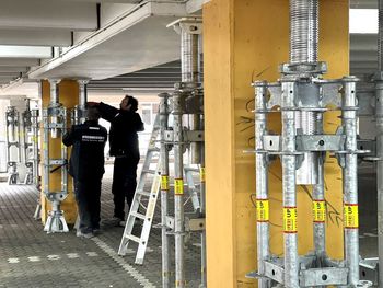 Rear view of man working at construction site