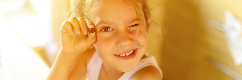 Close-up portrait of smiling girl