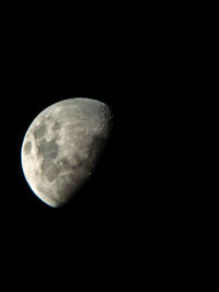 Close-up of moon over black background