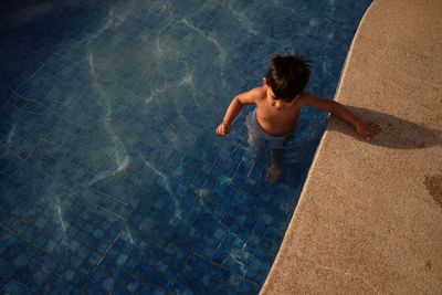 High angle view of boy in swimming pool