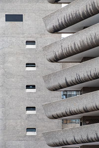 Full frame view of balconies on brutalist building 