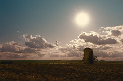 Scenic view of field against sky during sunset