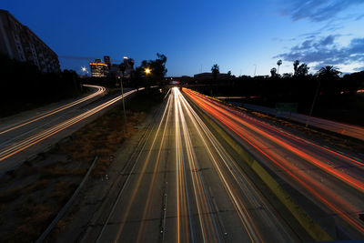 High angle view of light trails on road at night