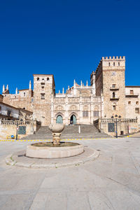 View of historic building against clear blue sky