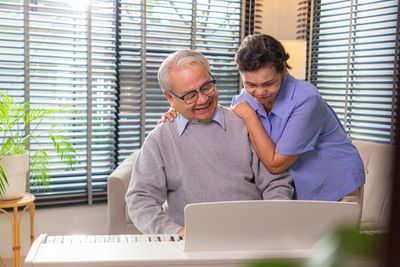 Young man using laptop at home